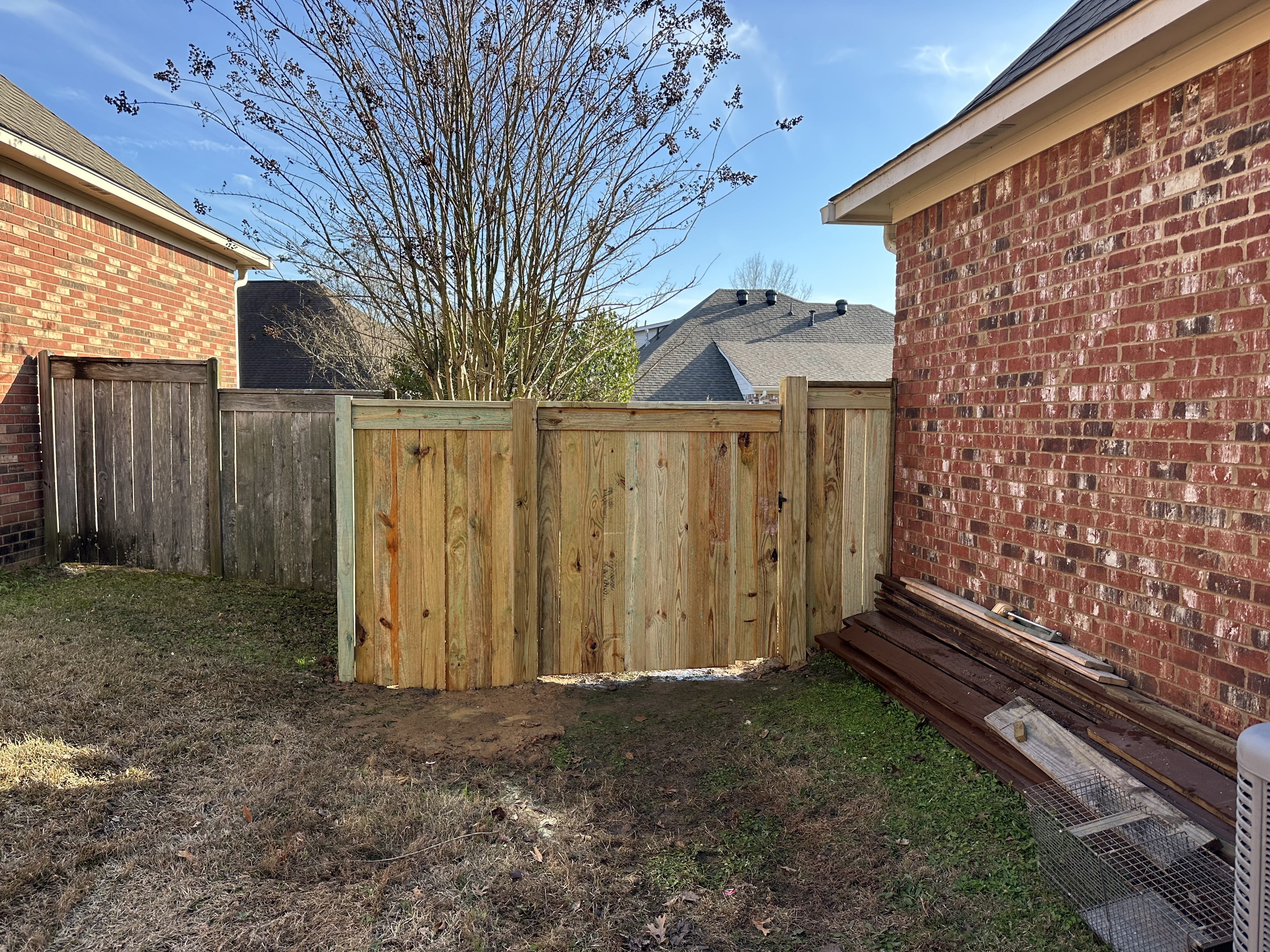 New pressure-treated fence corner